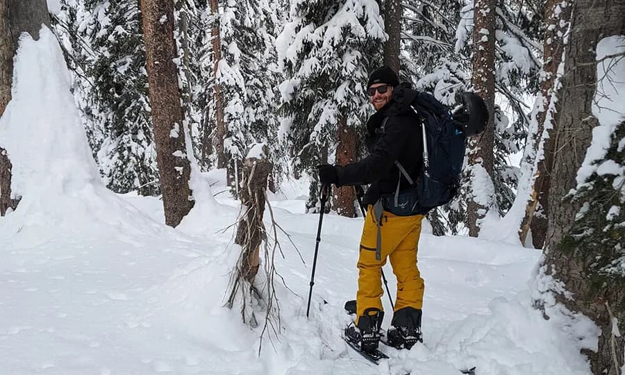 Eric splitboarding through deep snow